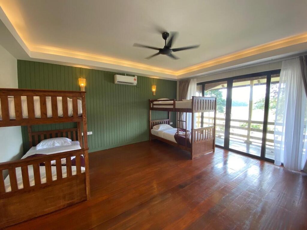 Quad-share dormitory chalet with bunk beds at Hornbill Lodge, Kinabatangan
