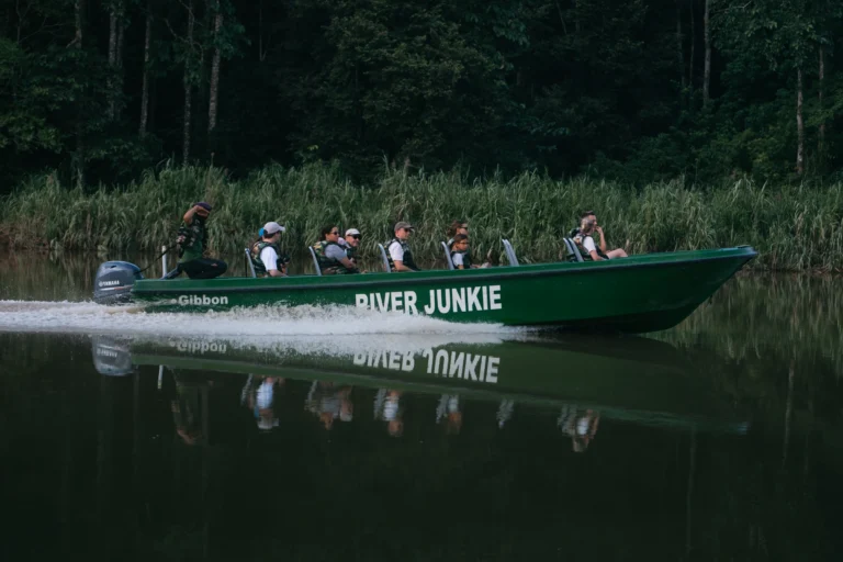 Guests on a River Junkie boat cruising the Kinabatangan